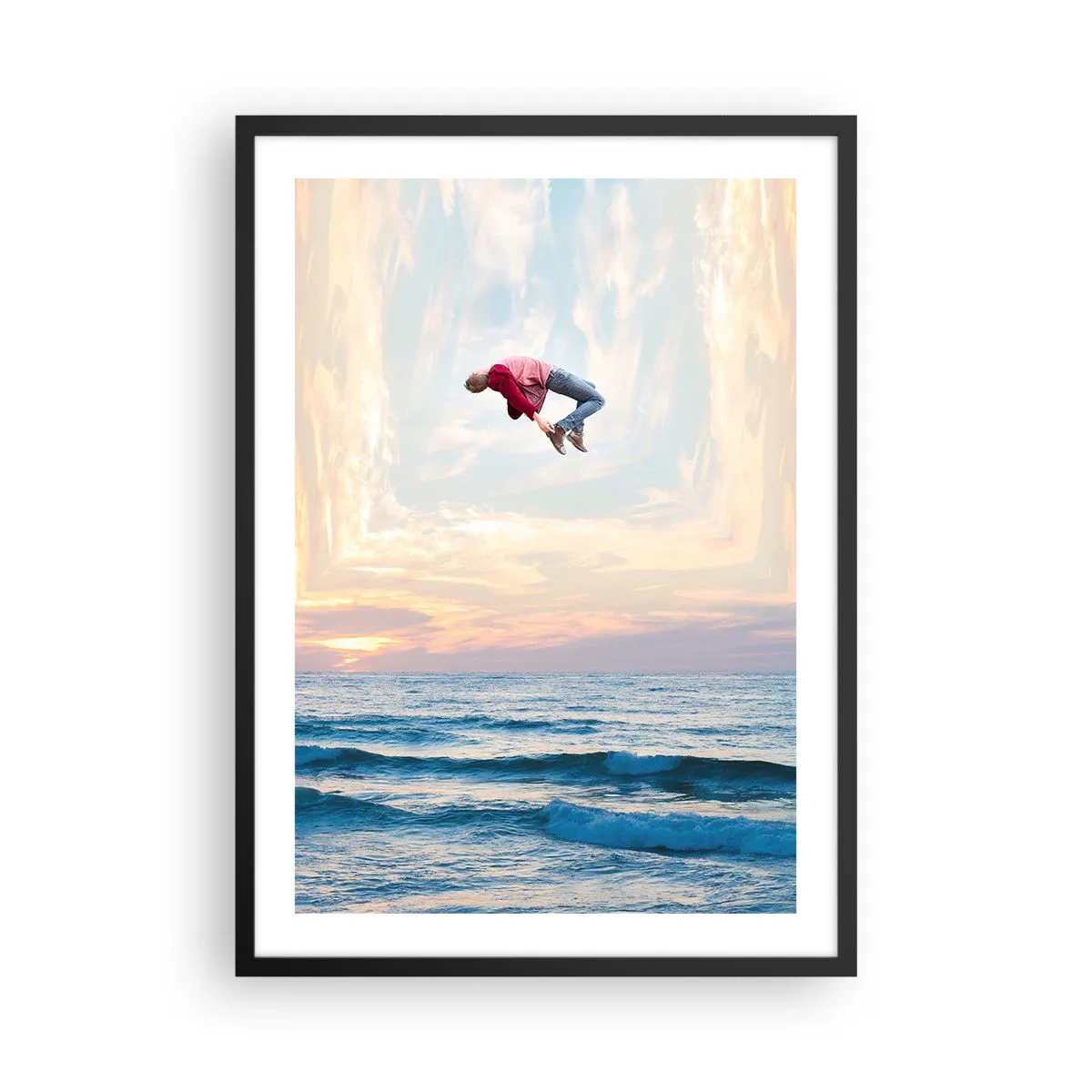 Poszter fehér keretben - Egy férfi naplementekor az óceán felett az égbe ugrik - 50x70cm - Egy másik dimenzióba - Modern fali dekoráció nappalihoz és hálószobához ARTTOR